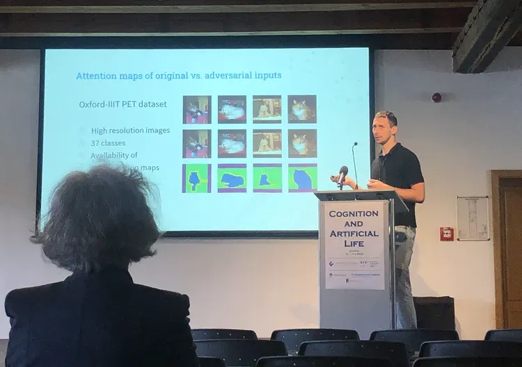 Štefan Pócoš presents at the Cognition and Artificial Life conference